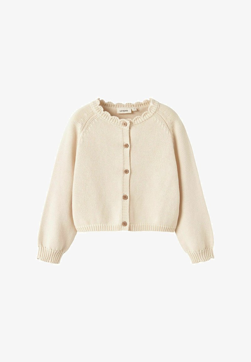 Kremna pletena jopica z nabrano ovratnikom, dolgimi rokavi in petimi lesenimi gumbi spredaj. Skrajšana dolžina.