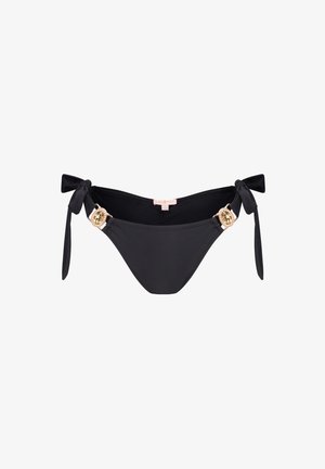 Černé bikiny s nohavičkami na bocích, zdobené zlatými detaily s kamínky. Hladká textura, minimalistický design.