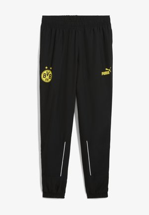 Zwarte sportbroek met een elastische tailleband, gele logo's van BVB en Puma, en witte accenten bij de zakken en boorden.