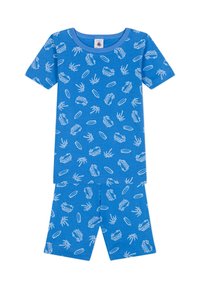 Ensemble de pyjama en coton bleu comprenant un haut à manches courtes et des shorts. Le design comprend des motifs blancs de voitures, de palmiers et de planches de surf.
