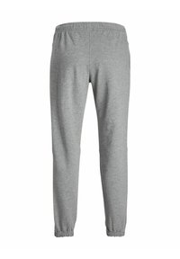 Grå mjukisbyxor tillverkade av ett mjukt material med elastisk midja och mudd, med en enkel och stilren design utan ytterligare mönster.