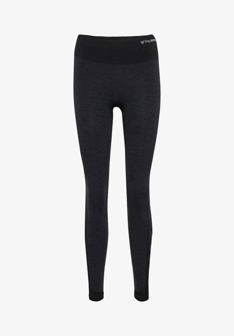 Svarta atletiska leggings med ett texturerat tyg och en bred, elastisk midja. Har sidopanelaccenter för andningsförmåga.