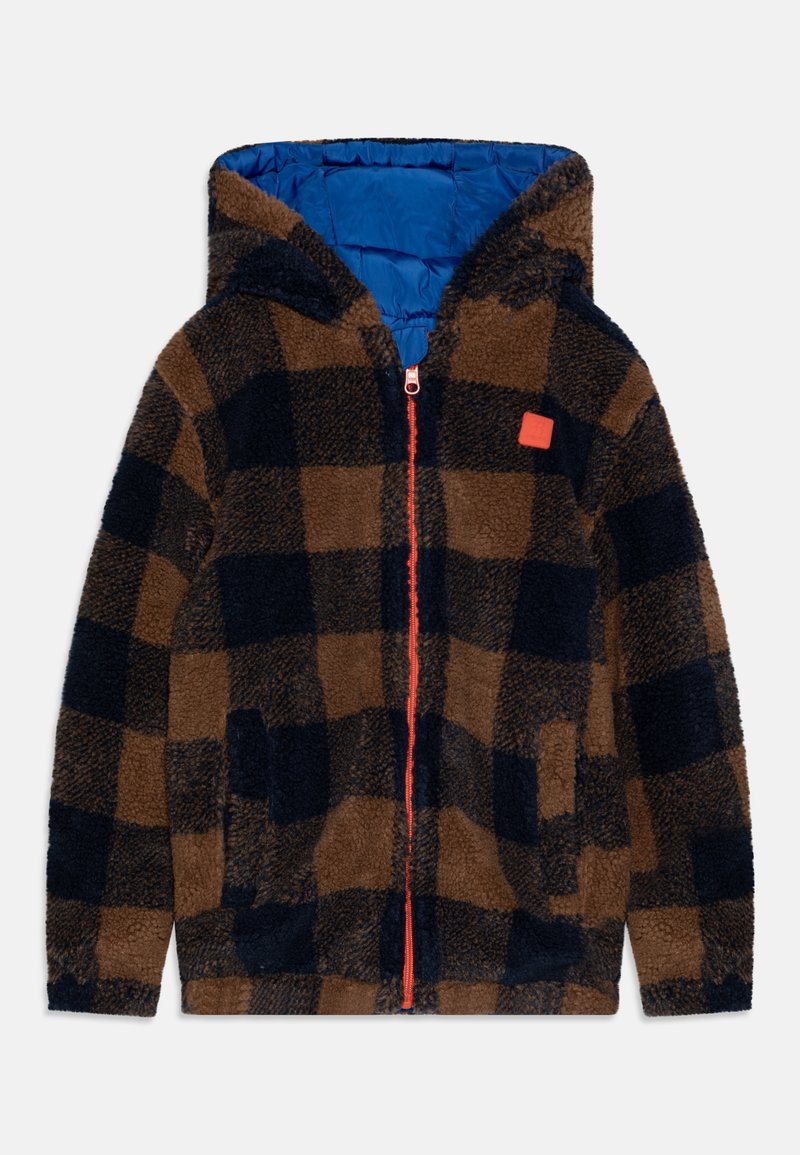 Brązowa i granatowa, w kratę, polarowa kurtka z pomarańczowym zamkiem, z kapturem i dwiema bocznymi kieszeniami. Podszewka wykonana z niebieskiego nylonowego materiału.
