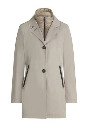 Beiger Mantel mittlerer Länge mit Knopfverschluss, schwarzen Reißverschlusstaschen an den Seiten und gesteppter innerer Kragen mit Reißverschluss.