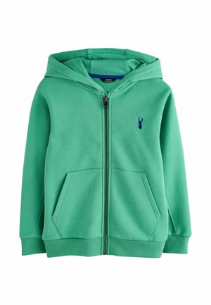 Roheline kapuutsiga lukuga pusa, ees taskud, soonilised varrukasääred ja väike tumesinine hirve logo rinnal.