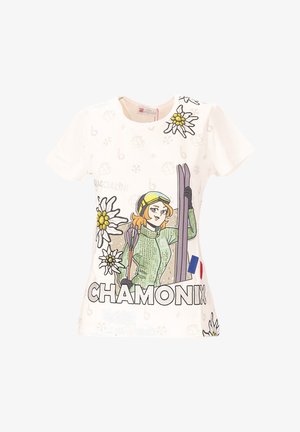 Witte katoenen T-shirt met een afbeelding van een skier in groene kleding, bloemen en de tekst "CHAMONIX" met een Franse vlag accent.