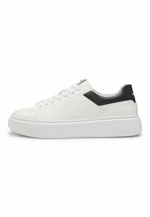 White low-top sneaker with thick sole, black heel detail, and embossed "HUGO" logo on side.