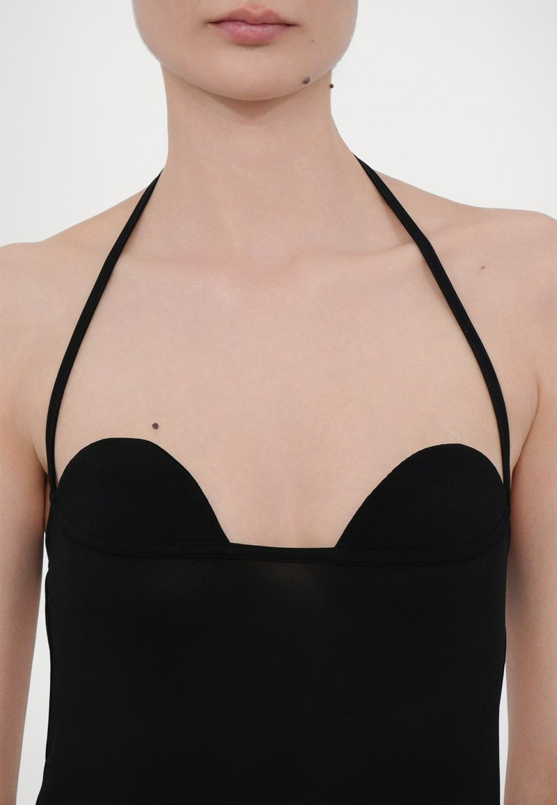 Black bodysuit with a deep V-neck design, thin straps, smooth texture, and no visible fastenings or embellishments.