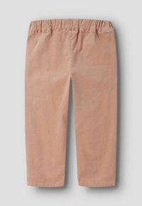 Vaaleanruskeat taaperohousut, joissa on joustava vyötärönauha ja suoralahkeiset, aseteltu tasaiselle harmaalle taustalle.