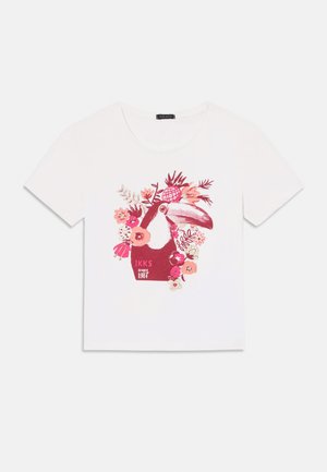 White cotton t-shirt featuring a colorful floral print with a toucan design and the text "IKKS since 1987" in pink. Short sleeves and crew neck.