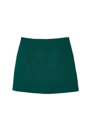 Gonna verde, lunghezza al ginocchio, realizzata in tessuto liscio con sottili pieghe sul davanti e una chiusura lampo laterale discreta. Senza motivi o accenti.