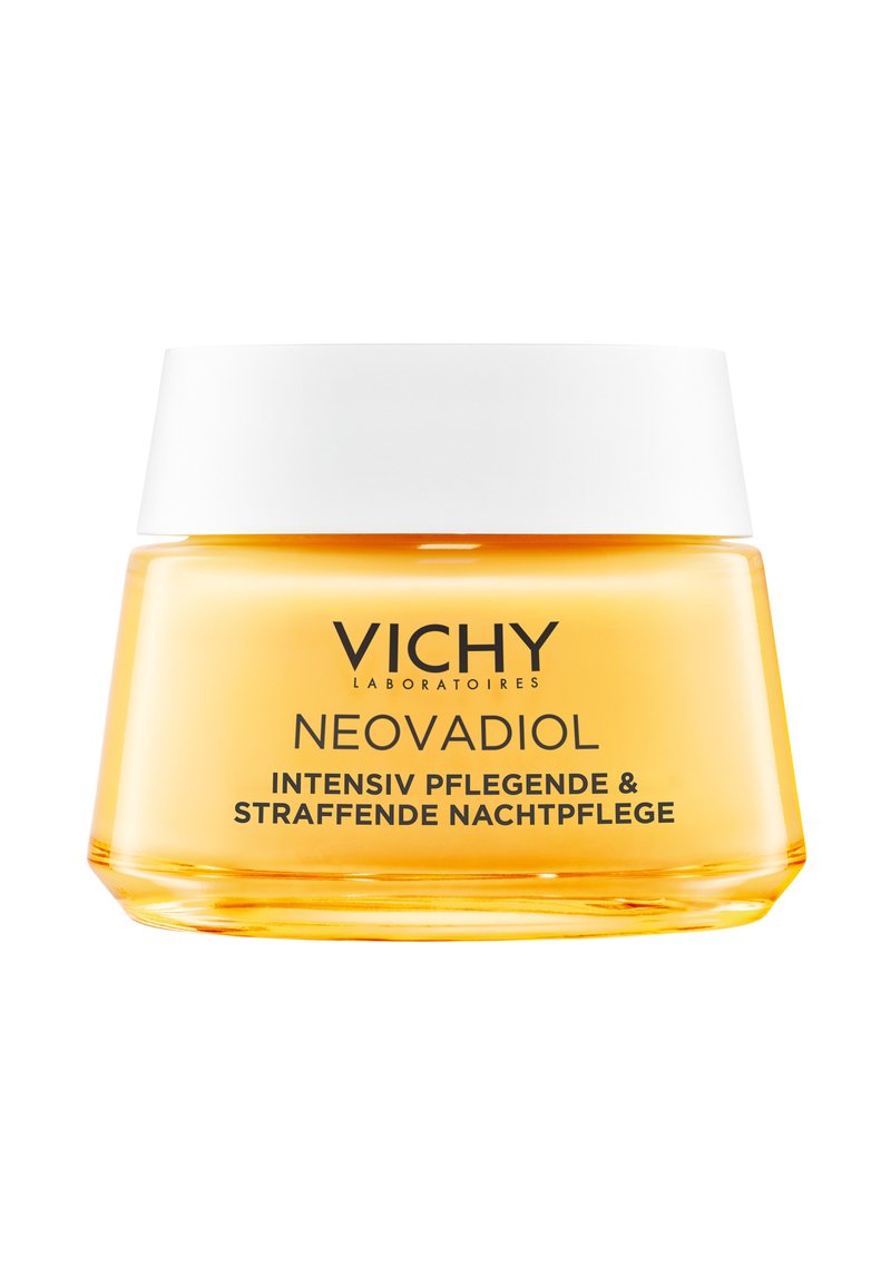 Glass jar with a transparent orange-yellow body and a white lid. Text on the jar indicates it is Vichy Neovadiol night cream.