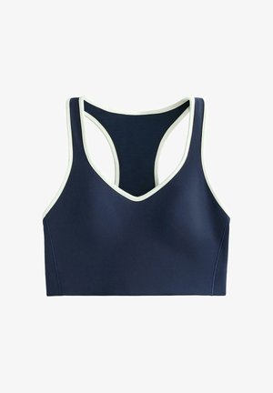 Marineblå sports-bh med V-hals og racerback-design, med hvide detaljer. Fremstillet af elastisk materiale, den har en glat tekstur og ingen polstring.
