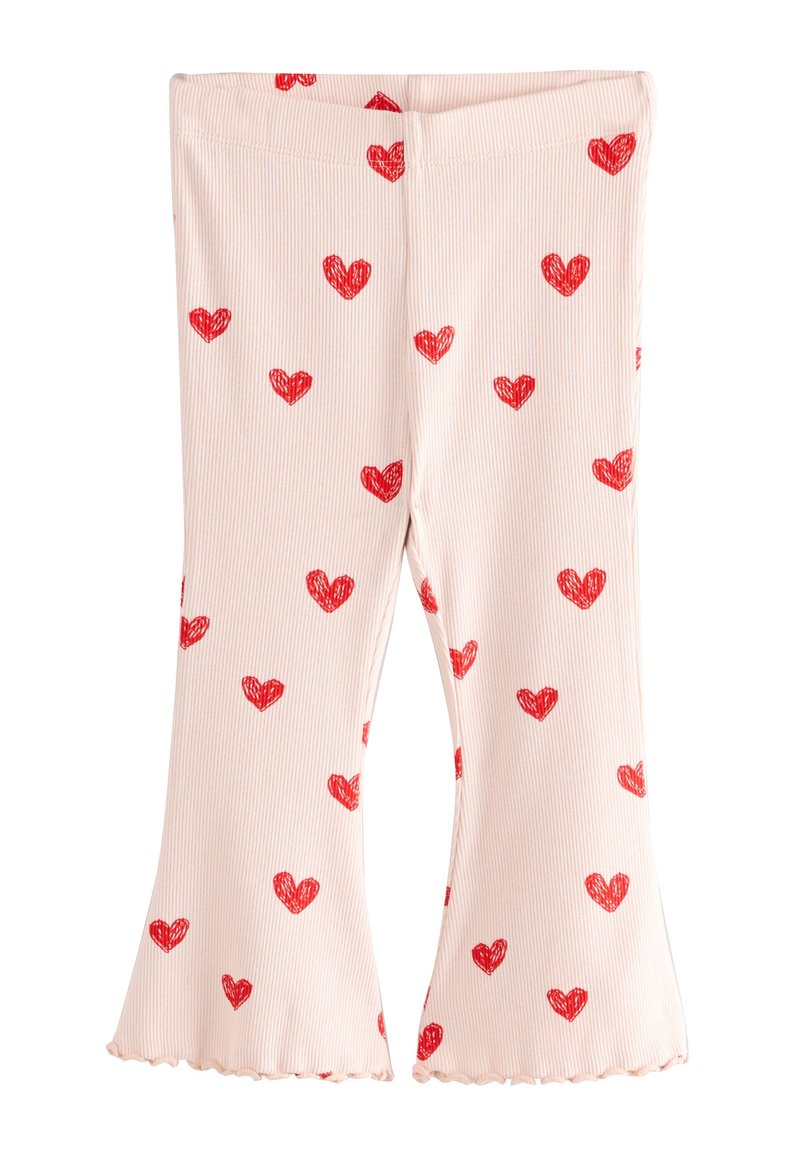 Svetloružové rebrované legíny s červenými srdiečkovými vzormi po celej ploche. Majú rozšírený lem a na spodku vlnkové okraje.