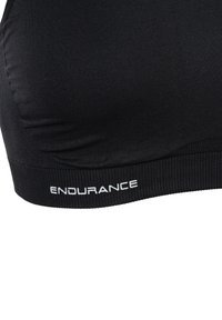 Sort sports-bh lavet af glat stof, med en komfortabel pasform og en ribbet kant. "ENDURANCE" logo i hvidt præget på kanten.