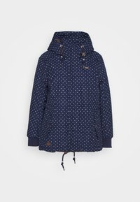 Navy blue parka jacket with white polka dots, a hood with drawstring, two front pockets, and elastic cuffs. Features brown accents.