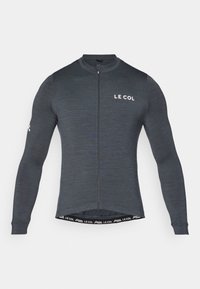Maillot de cyclisme à manches longues en tissu gris foncé, avec une fermeture éclair à l'avant et un logo "LE COL" blanc sur la poitrine et la manche. Design stretch et ajusté.