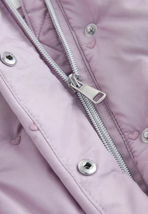 Light purple jacket fabric with quilted texture. Silver zipper and hardware; small embroidered heart details visible near zipper and snaps.