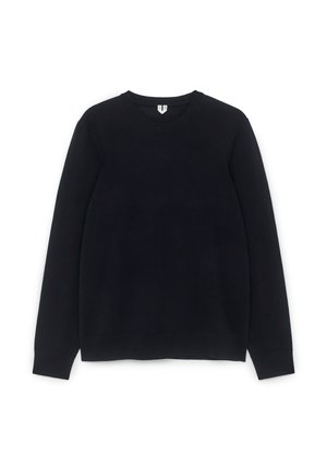 Schwarzer Rundhalsausschnitt-Pullover aus weichem Stoff. Verfügt über lange Ärmel und gerippte Bündchen. Einfaches Design ohne sichtbare Muster oder Akzente.