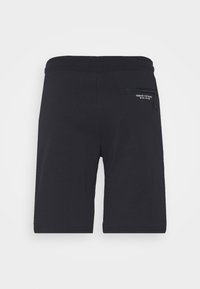 Pantaloni sportivi neri con una texture liscia, dotati di una tasca con zip sul lato destro posteriore e un logo ricamato sulla tasca.