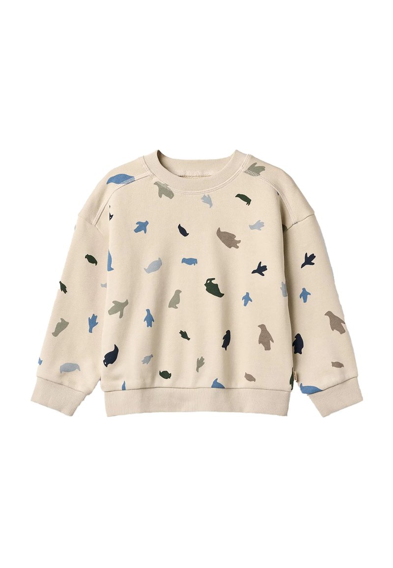 Sweat-shirt beige à coupe ample avec une variété de petites formes d'animaux colorées en bleu, vert et marron réparties sur l'ensemble.