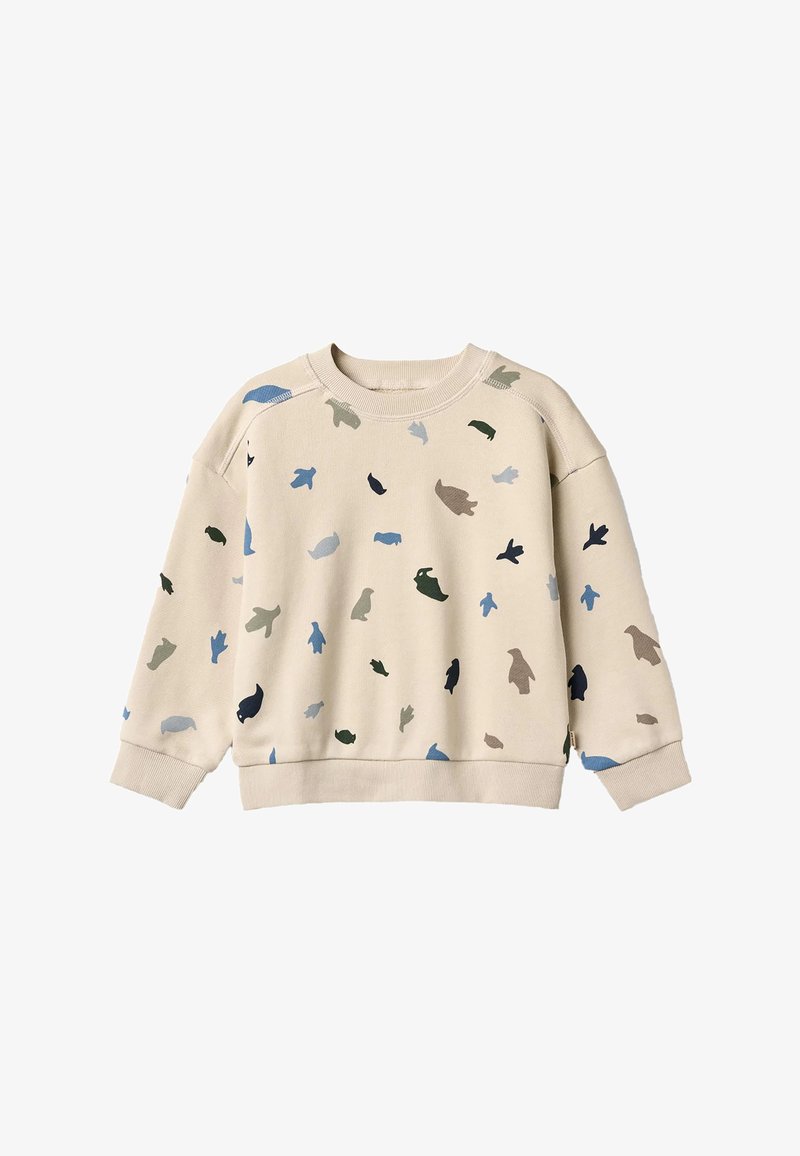 Sweat-shirt beige à coupe ample avec une variété de petites formes d'animaux colorées en bleu, vert et marron réparties sur l'ensemble.