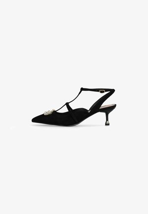 Scarpa slingback nera in suede con punta affusolata, tacco basso, design a T e decorazioni con gemme sulla parte anteriore. Texture liscia.
