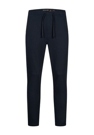 Pantaloni jogger blu scuro realizzati in morbido tessuto, con una vita elastica dotata di cordoncino e gamba affusolata. Senza motivi o accessori visibili.