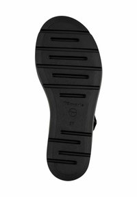 Suola di scarpa in gomma nera con righe orizzontali, logo inciso e misura "37". Superficie testurizzata per aderenza e durabilità.