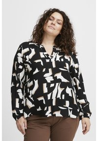 Blusa nera con un motivo geometrico astratto in bianco e beige. Presenta una scollatura a V e maniche lunghe con polsini elasticizzati.