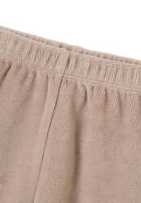 Lichtbeige terry stof met een zachte textuur. Elastische tailleband met geplooide details. Glad afgewerkte randen met verfijnde stiksels.