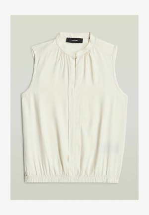 Blusa smanicata color crema con tessuto raccolto al collo e orlo elastico, caratterizzata da una patta frontale con bottoni nascosta e scollo rotondo.