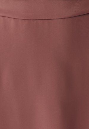 Smooth fabric close-up in muted rose color with subtle seam detail near the top edge.