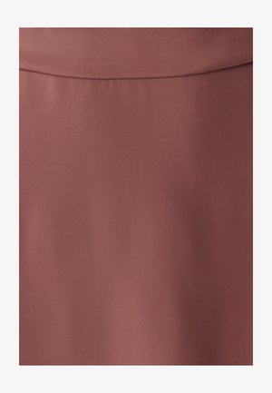 Smooth fabric close-up in muted rose color with subtle seam detail near the top edge.