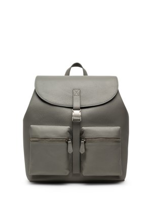 Gray leather backpack with a flap top and two front zippered pockets, shown against a white background.