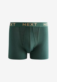 Zöld férfi boxeralsó, puha anyagból készült, arany színű márkázott derékpánttal, amelyen a "NEXT" felirat ismétlődik, és testhezálló fazonnal rendelkezik.