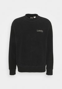 Maglione girocollo nero con polsini e vita a costine, con piccolo logo bianco di Levi's sul lato sinistro del petto.