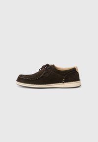 Brown suede shoe with a rounded toe, white stitching, and beige rubber sole. Features brown laces and a soft interior lining.