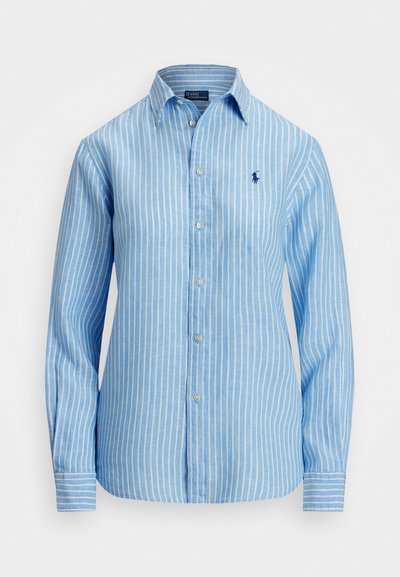 Modra črtasta dolgosleeva srajca iz lahkega materiala. Ima klasičen ovratnik, gumbasto zapenjanje in majhen vezen logotip na prsih.