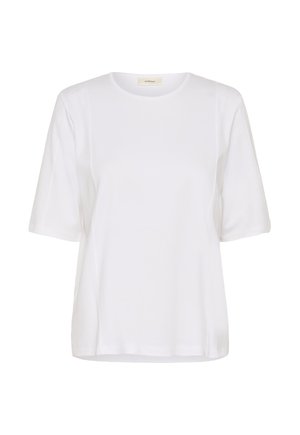 Balta īsroku T-krekls ar apaļu kaklu, redzamām sānu šuvēm un mazu bēša krāsas etiķeti apkakles iekšpusē.