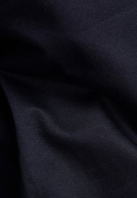 Dark navy fabric with a smooth texture, featuring subtle diagonal ribbing patterns and a glossy finish.