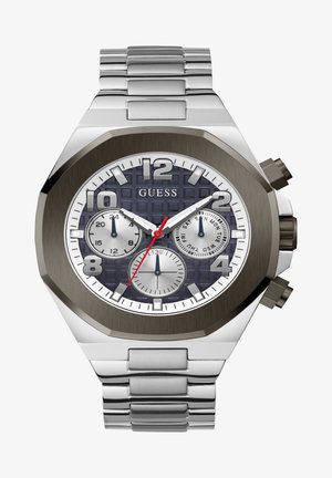 Hõbedane roostevaba terasest kell, millel on kaheksanurkne korpus, tekstureeritud tume sinine kellanägu, valged ja hõbedased aladialid ning punased aktsendid. Omab metallist randmeantry.