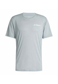 Camiseta de manga corta gris claro con un diseño minimalista y un pequeño logo blanco "TERREX" en la parte superior izquierda del pecho.