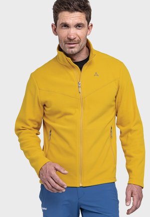 Gelbe Fleecejacke mit Reißverschluss, zwei seitlichen Reißverschlusstaschen und einem dezenten Logo. Glatte Textur, taillierte Passform und hoher Kragen.