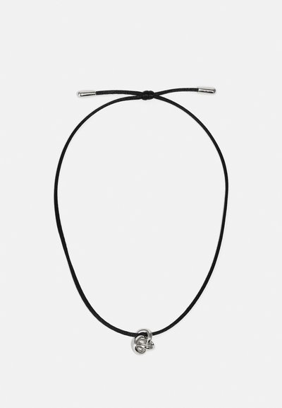 Black cord necklace featuring a silver metal accent with a knotted design. The cord has a smooth texture and metal tips.
