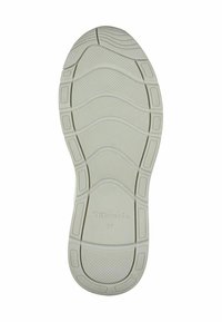 Sole di scarpa in gomma di colore chiaro con un motivo testurizzato e scanalature di flessione, con un logo e la taglia "37" stampati sul fondo.