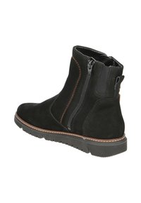 Schwarze Wildleder-Ankle Boots mit doppelten Seitenreißverschlüssen, braunen Nähakzenten, strukturiertem Gummisole und rundem Zehendesign.