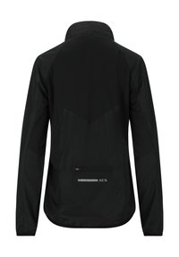 Sort letvægtsjakke med høj krave, raglanærmer og en lynlåslomme på ryggen. Har en mat overflade og "ENDURANCE XCS" branding.