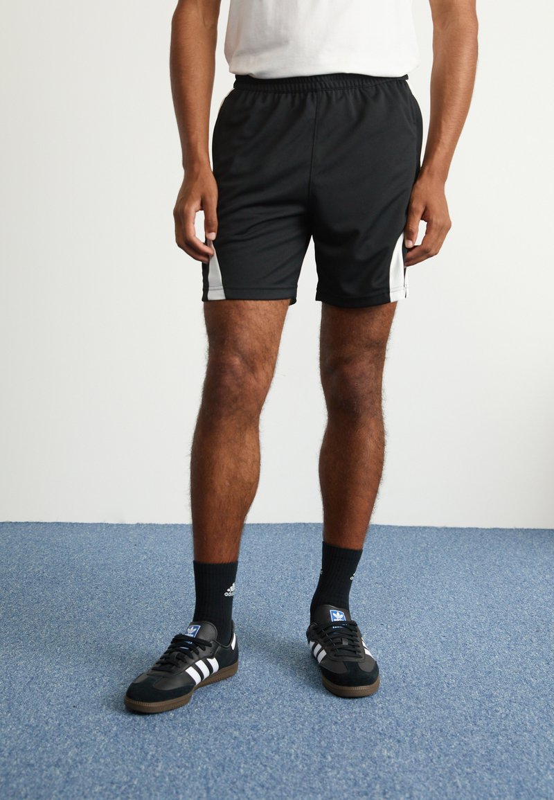 adidas Originals ADIDAS NTS RADIO ALLOVER PRINTED SUPERSTAR TRACK PANTS - Teplákové kalhoty - black