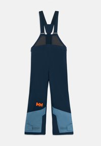 Marineblå vanntette bibbukser med justerbare skulderstropper og lyseblå forsterkede kne-lapper, med en oransje "HH" logo på beinet.